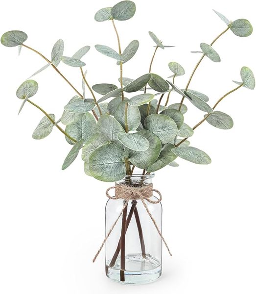 Faux eucalyptus in glass vase – navy and gold powder room ideas